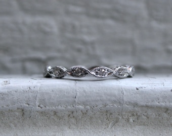 Twisted 14K White Gold Diamond Wedding Band with Engraved Sides.