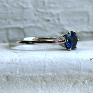 Stunning Sapphire Solitaire in 14K White Gold.