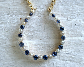 Vintage 14K Yellow Gold Pearl and Sapphire Horseshoe Necklace.