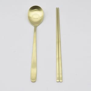 May include: A rustic wooden sign with the text "Welcome to our home" in white lettering. The sign features a distressed finish and a simple, inviting design, perfect for a front porch or entryway.