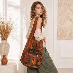 May include: A brown and orange patterned shoulder bag with multiple pockets and a peace sign applique. The bag has a long strap and a zippered top. The bag is made of a textured fabric and has a bohemian style.