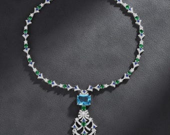 Collar largo de lujo con colgante, cadena llamativa para suéter, opciones en azul y rojo.