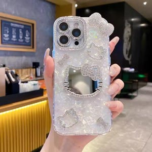Cute Hello Kitty Makeup Mirror Phone Case, 3D Cartoon Sanrio Glitter Cover, Shockproof Hard Case for iPhone 12–17 Pro Max Color B