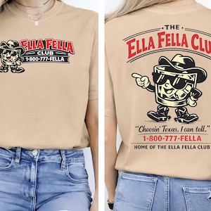 May include: A beige short-sleeved t-shirt with a cartoon whiskey glass wearing a cowboy hat and sunglasses. The front of the shirt says "ELLA FELLA CLUB" and a phone number. The back of the shirt has the same graphic and the phrase "Choosin' Texas, I can tell."
