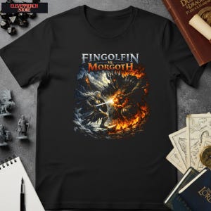 May include: Black t-shirt with a fantasy battle scene and the text "Fingolfin vs. Morgoth." The graphic shows a warrior in white fighting a dark figure surrounded by fire and ice. The shirt has a crew neck and short sleeves.