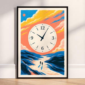 May include: A framed wall art print featuring a circular clock face with black numerals and hands centered over a landscape illustration. The scene depicts two figures walking on a path between blue hills under a sunset sky with orange clouds.