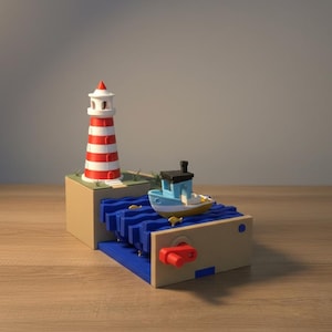 May include: A nautical-themed toy featuring a red and white striped lighthouse, a blue and white boat, and a blue wave design. The toy has a beige base and a red crank. The lighthouse is approximately 4 inches tall.