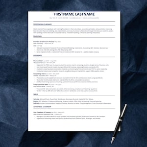 May include: A professional resume template printed on white paper with black text, featuring sections for professional summary, education, experience, skills, and activities. A black and silver ballpoint pen rests on the bottom right corner.