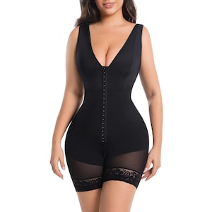May include: Black shapewear bodysuit with a deep V-neck and hook-and-eye closure down the front. The sleeveless garment features sheer mesh panels on the shorts with lace trim. The bodysuit is designed to smooth and shape the body.