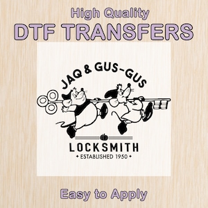 May include: A DTF transfer design featuring Jaq and Gus-Gus from Cinderella, holding a key. The design includes the text "LOCKSMITH" and "ESTABLISHED 1950". The words "High Quality DTF TRANSFERS" and "Easy to Apply" are also included.