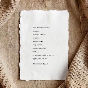 May include: A rectangular piece of white paper with deckled edges featuring black typewriter text that reads: Your favourite quote, slogan, personal letter, prayer, wedding vows, song lyrics, newborn details, poem, or message could be here - typed just for you. The Bookish Typiet.