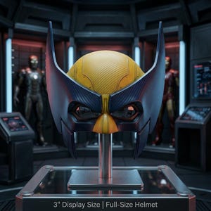 May include: A yellow and dark blue helmet with tall, pointed side fins and a textured surface. The helmet is mounted on a silver stand and features the text 3" Display Size | Full-Size Helmet printed clearly at the bottom of the frame.