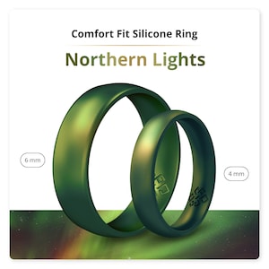 May include: Two silicone rings in a green color with a Northern Lights pattern. The larger ring is 6 mm wide and the smaller ring is 4 mm wide. Comfort Fit Silicone Ring Northern Lights.