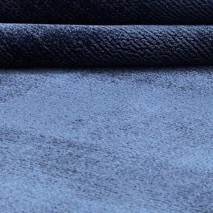 May include: A white ceramic mug with a black handle and the text "But First, Coffee" in a handwritten style. The mug is on a white surface. The mug is approximately 4 inches tall.