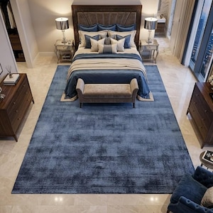 May include: A set of three ceramic mugs with a speckled, matte finish. The mugs are in shades of cream, light gray, and dark gray. Each mug has a simple, modern design and a rounded handle. Perfect for coffee or tea.