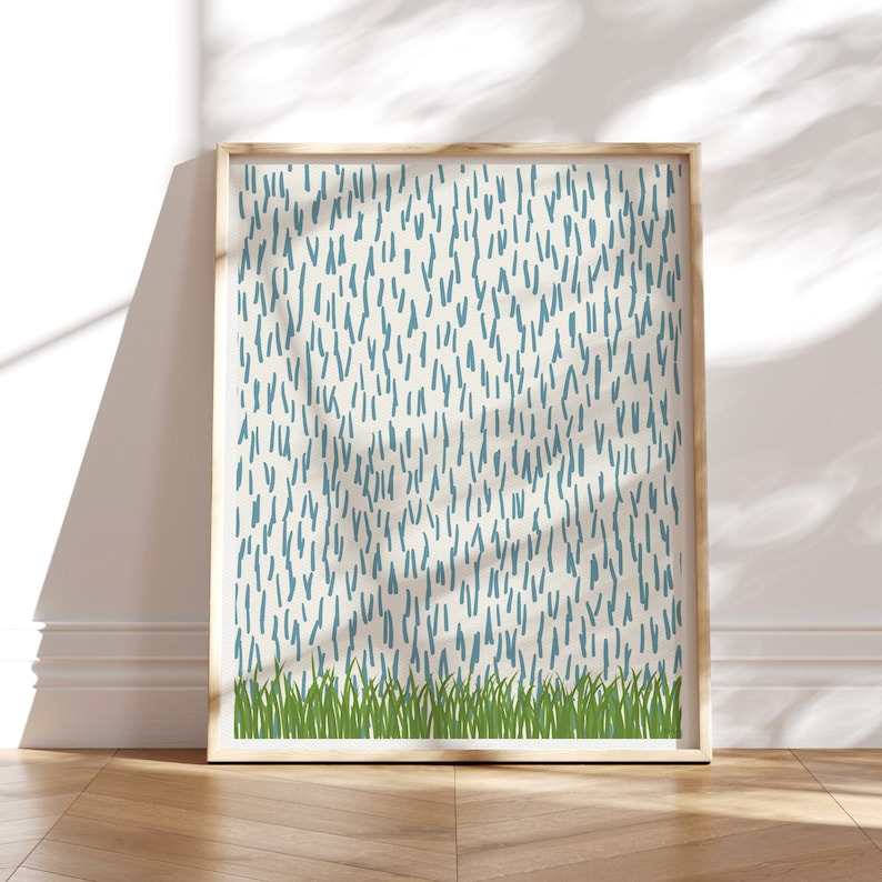 May include: A framed print with a white background and a pattern of blue lines. The bottom of the print features a row of green grass.