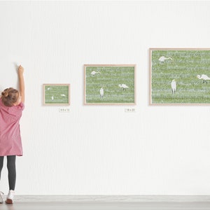 May include: Three framed prints of white birds in a green field. The prints are in different sizes, with the smallest being 9.5 x 12 inches, the middle being 18 x 22 inches, and the largest being 25 x 31 inches.