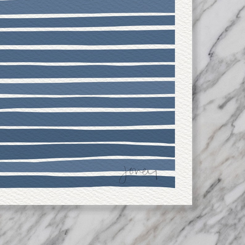 May include: A blue and white striped print with a handwritten signature in the bottom right corner.