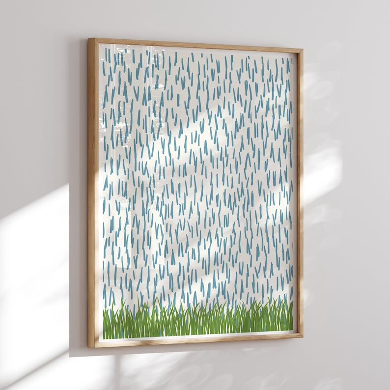 May include: A framed abstract print with a white background and a pattern of blue lines. The bottom of the print features a row of green grass.