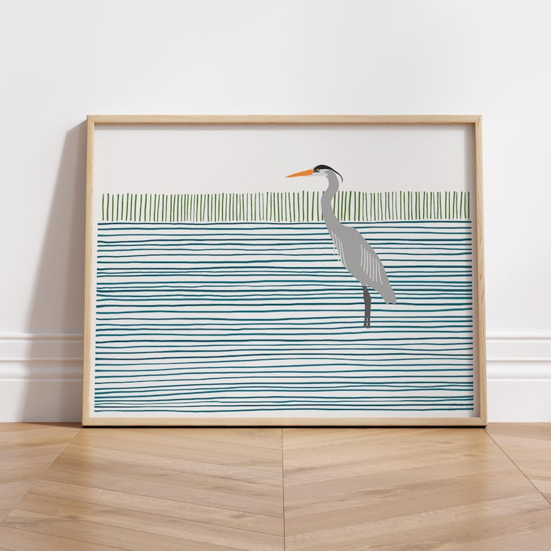 May include: A framed illustration of a gray heron standing in a blue and green striped pattern.