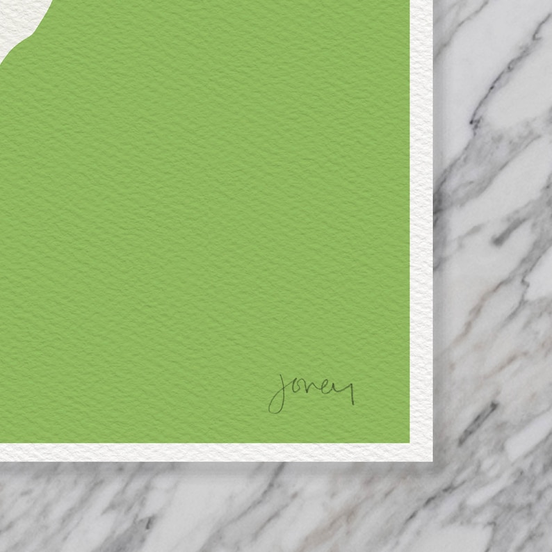 May include: A green textured paper with the word "joney" written in black ink.