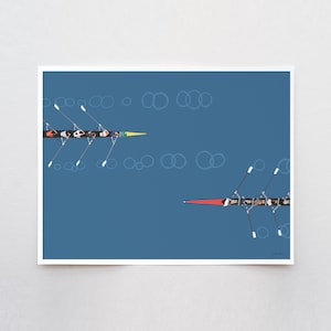 May include: A graphic art print on a blue background featuring two rowing shells viewed from above. One boat has a yellow bow and the other has a red bow. Each shell contains multiple rowers with oars extended into the water, creating circular ripples.