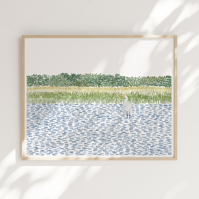 May include: A framed illustration of a white egret standing in a blue body of water. The background is a green and yellow landscape of grass and trees. The illustration is made up of small, repeated lines and dots.