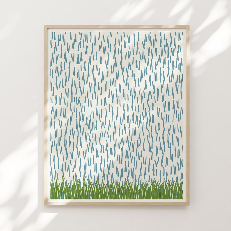 May include: A framed print with a white background and a pattern of blue lines. The bottom of the print has a row of green grass.