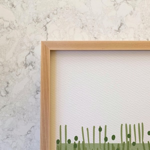 May include: A framed print with a minimalist design featuring a green line pattern and green dots on a white background.