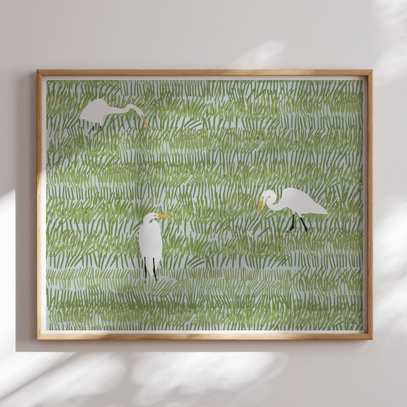 May include: A digital illustration of three white egrets standing in a field of green grass. The egrets are facing different directions and have long, slender necks and beaks.