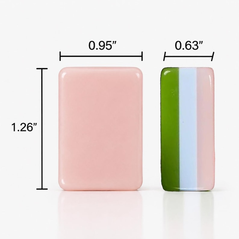 May include: Two rectangular tiles with rounded corners. The left tile is solid light pink, measuring 0.95 inches wide by 1.26 inches high. The right tile features vertical stripes of olive green, light blue, and light pink, measuring 0.63 inches wide.