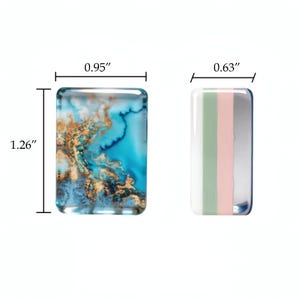 May include: Two rectangular cabochons. The left piece features a blue and gold marbled pattern measuring 0.95 inches wide by 1.26 inches high. The right piece features vertical stripes of white, sage green, pale pink, and silver, measuring 0.63 inches wide.