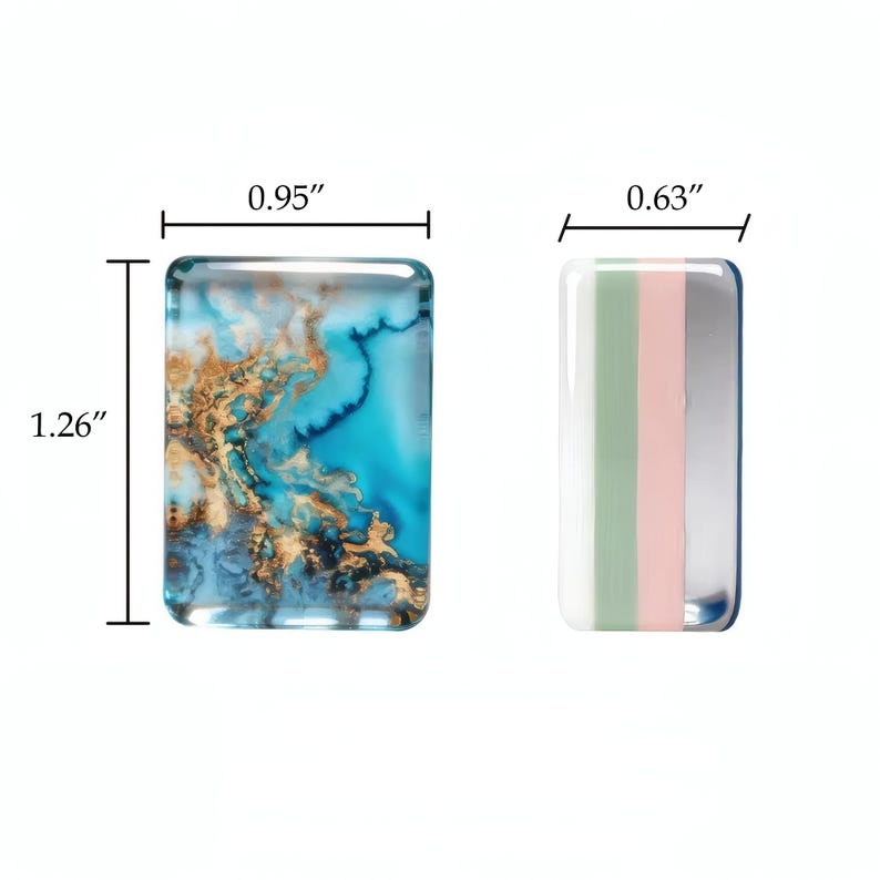 May include: Two rectangular cabochons. The left piece features a blue and gold marbled pattern measuring 0.95 inches wide by 1.26 inches high. The right piece features vertical stripes of white, sage green, pale pink, and silver, measuring 0.63 inches wide.
