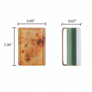 Puede incluir: Dos componentes rectangulares. La pieza de la izquierda tiene una textura moteada naranja y marr&oacute;n, midiendo 2,41 cm de ancho por 3,20 cm de alto. La pieza de la derecha presenta un patr&oacute;n de rayas verticales verdes y blancas con un marco cobrizo, 1,60 cm de ancho.
