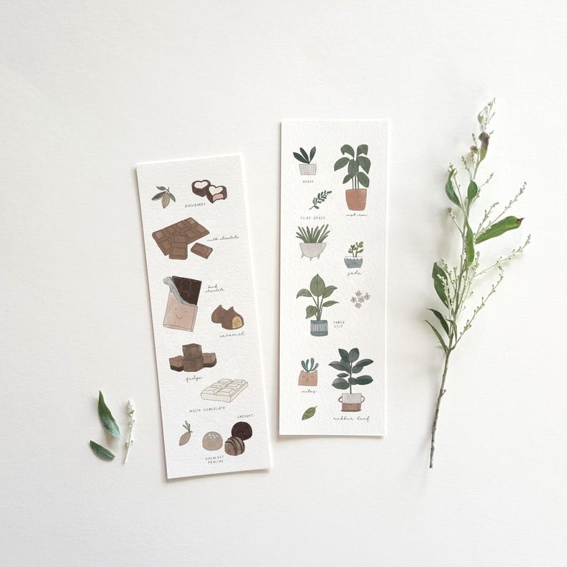 May include: Two illustrated bookmarks on a white background. One features chocolate varieties like fudge and truffles. The other showcases potted plants, including aloe vera and jade. Delicate green sprigs are placed near the bookmarks.