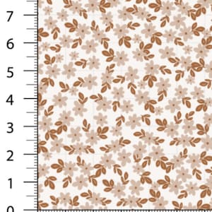 May include: A fabric swatch featuring a repeating floral pattern. The design includes small, light beige flowers and brown leaves and stems, set against a cream-colored background. The pattern is dense and detailed, creating a delicate, natural aesthetic.