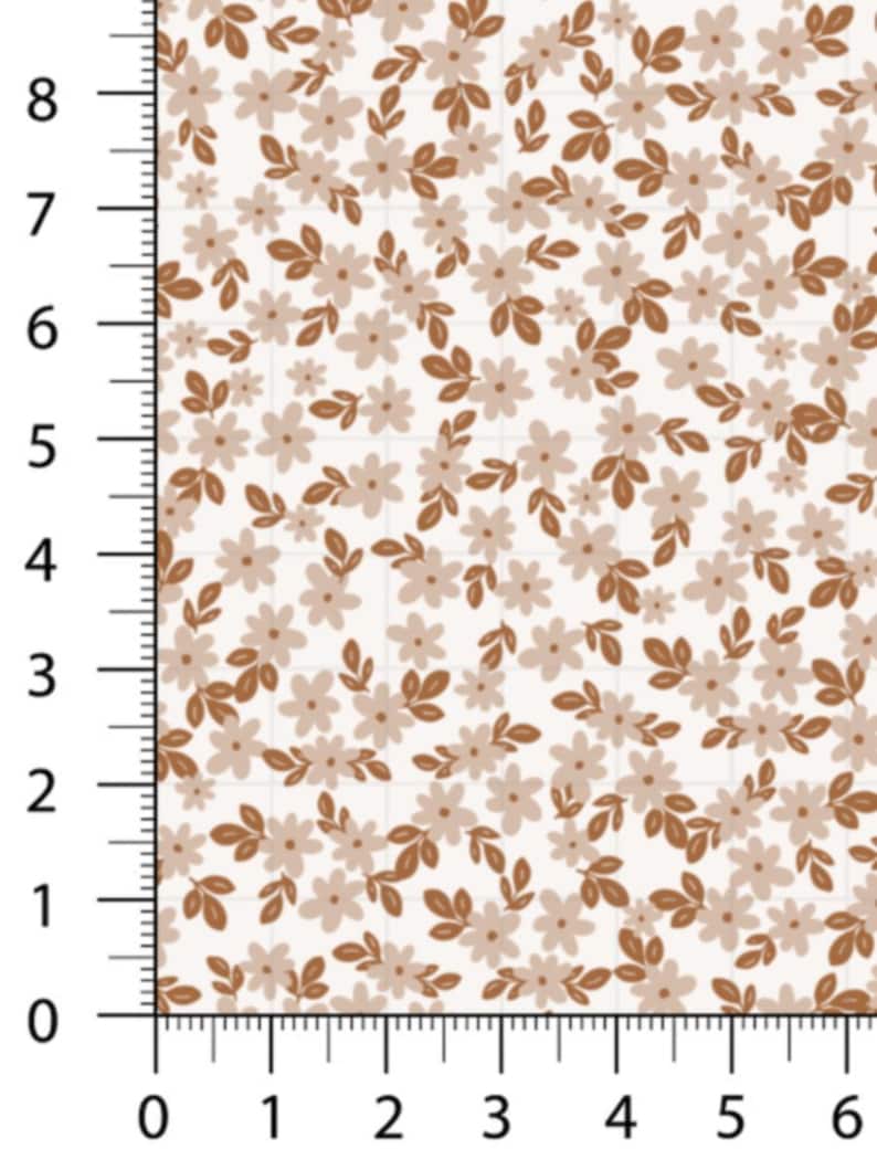 May include: A fabric swatch featuring a repeating floral pattern. The design includes small, light beige flowers and brown leaves and stems, set against a cream-colored background. The pattern is dense and detailed, creating a delicate, natural aesthetic.