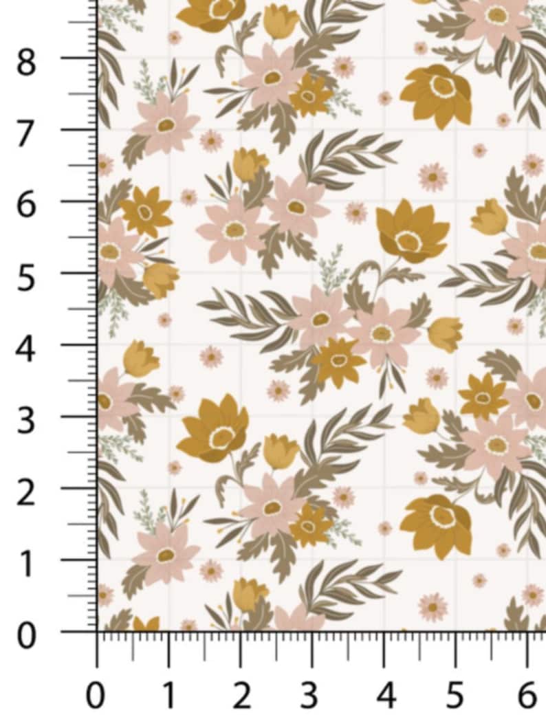 May include: Floral fabric with a repeating pattern of stylized flowers and leaves in shades of gold, pink, and brown on a white background. The fabric is marked with a grid and a ruler showing measurements in inches.