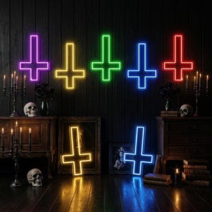 May include: A collection of neon inverted crosses in purple, yellow, green, blue, and red. The crosses are mounted on a dark wood-paneled wall. The scene includes antique furniture, skulls, candles, and framed artwork, creating a gothic aesthetic.
