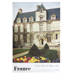 May include: A vintage travel poster for France featuring a photo of a stone building with a courtyard and flower garden. The text on the poster reads "France Saintes/Musée des Beaux-Arts".