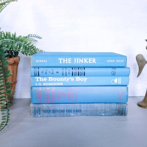 May include: A stack of five blue hardcover books with white titles. The top book is titled "The Jinker" by Dodd, Mead. The second book is titled "The Bounty's Boy" by I.G. Edmonds. The third book is titled "The Ring of Truth" by George Harmon Coxe. The fourth book is titled "The Science of Deduction" by Dorothy L. Sayers. The bottom book is titled "Soap Behind the Ears" by Cornelia Otis Skinner.
