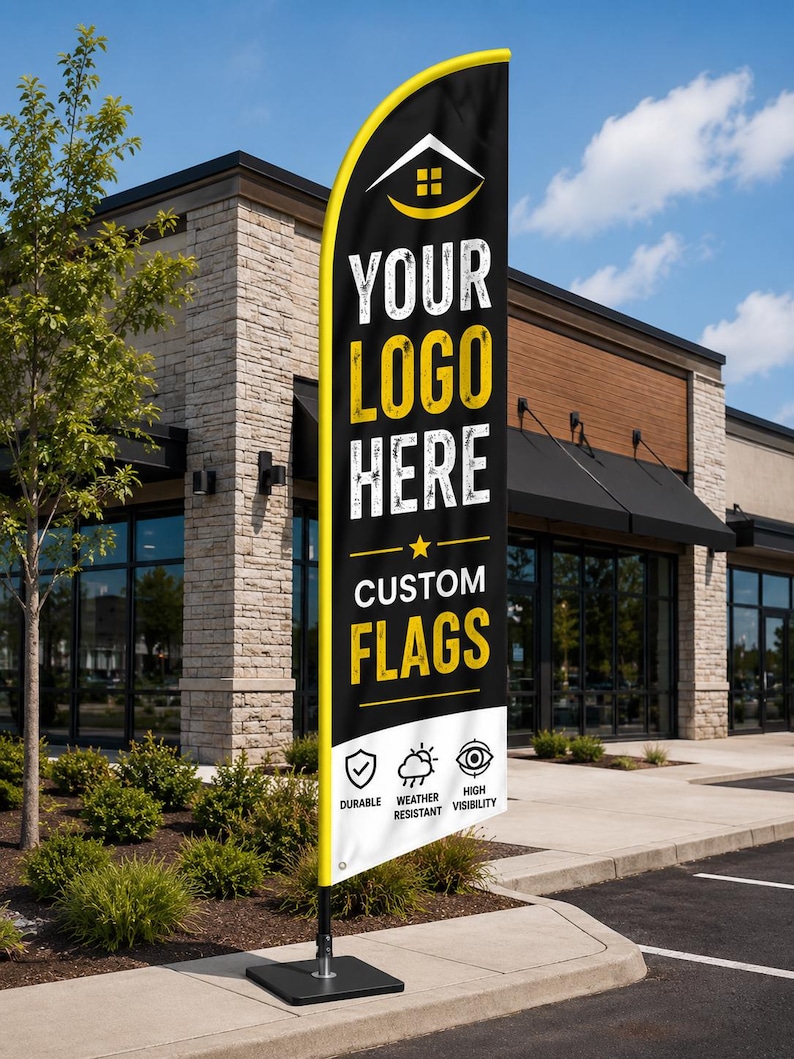 May include: A tall, black feather banner flag with a yellow border, featuring a white house icon, the text "YOUR LOGO HERE" and "CUSTOM FLAGS", and three icons labeled "DURABLE", "WEATHER RESISTANT", and "HIGH VISIBILITY" at the bottom.