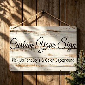 May include: A white ceramic mug with a black handle and the text "But First, Coffee" in a black, handwritten-style font. The mug is on a white surface.