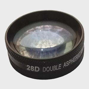 May include: A black 28D Double Aspheric lens with a textured band. The lens is circular with a clear, reflective surface. The text "28D DOUBLE ASPHERIC" is printed in white on the side of the lens.