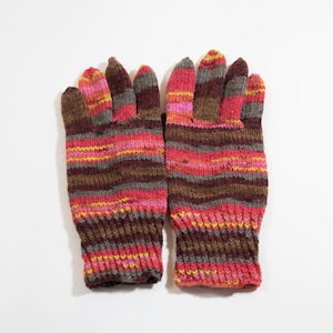 May include: A pair of striped knit gloves in brown, pink, and yellow.