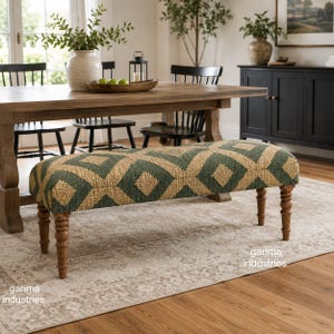May include: A rectangular upholstered bench featuring a dark green and tan diamond pattern fabric. The bench is supported by four turned wooden legs in a medium brown finish. The text garima industries is visible on the lower right and left.