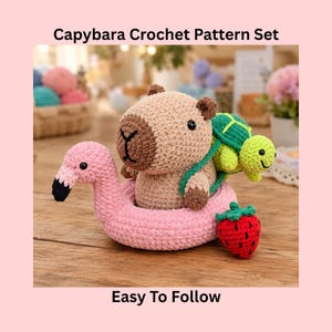 May include: A crocheted capybara sits in a pink flamingo floatie, with a green turtle on its back and a red strawberry nearby. The text "Capybara Crochet Pattern Set" and "Easy To Follow" are displayed.