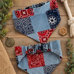 May include: Two triangular pet bandanas featuring a patchwork design of red and navy blue paisley patterns mixed with light blue and white gingham checks. Each bandana has a gathered elastic neckline for a comfortable fit around the neck.