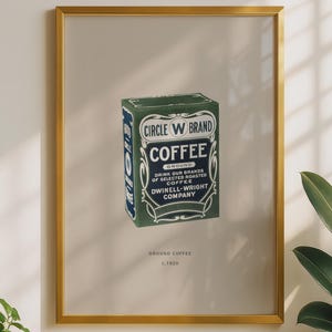 May include: A framed wall art print featuring a vintage green rectangular coffee tin labelled Circle W Brand Coffee, Dwinell-Wright Company, with the text Ground Coffee C. 1900 printed below the illustration in a simple, clean, and centred layout.
