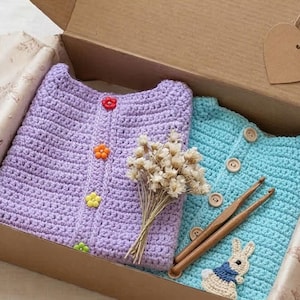 May include: A handmade, wooden serving tray with a natural finish. The tray features a rectangular shape with rounded corners and raised edges. It has two cut-out handles for easy carrying. The wood grain is visible, adding to its rustic charm.